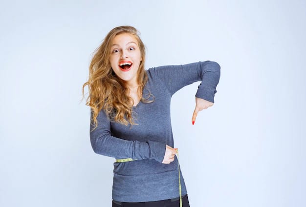 a girl measuring her waist with an inches tape.