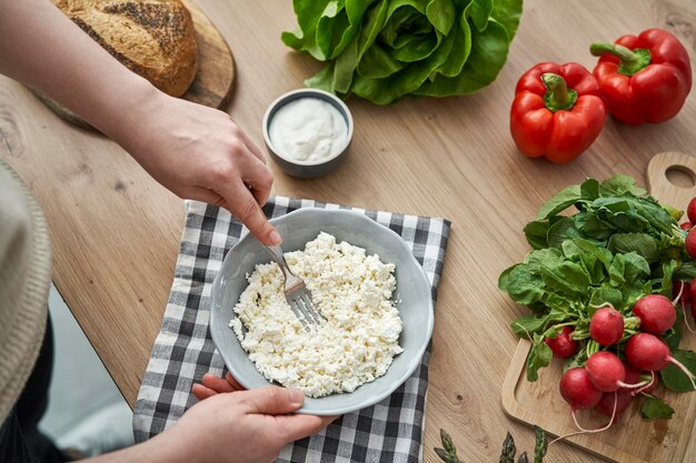 a female making a recipe with cottage cheese