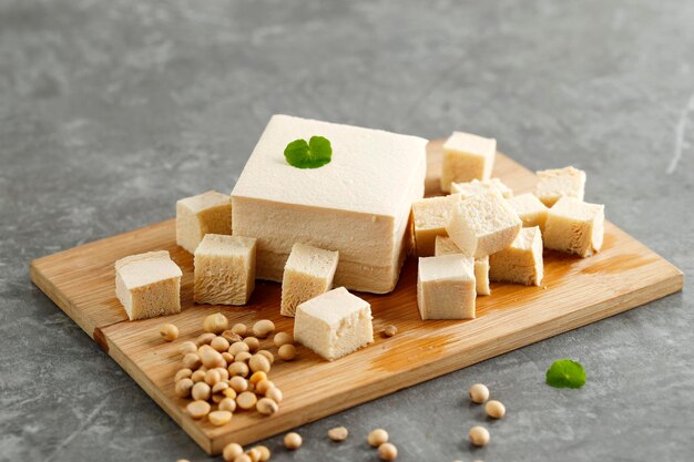 tofu placed on the wooden board.
