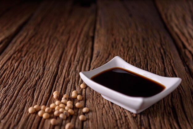 soy sauce placed on the wooden surface