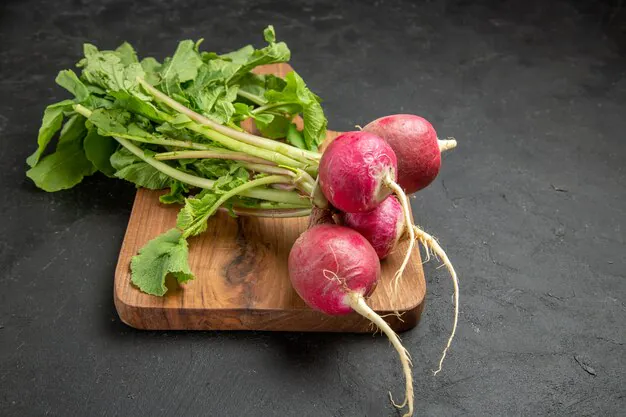 front view of radish placed on wooden board