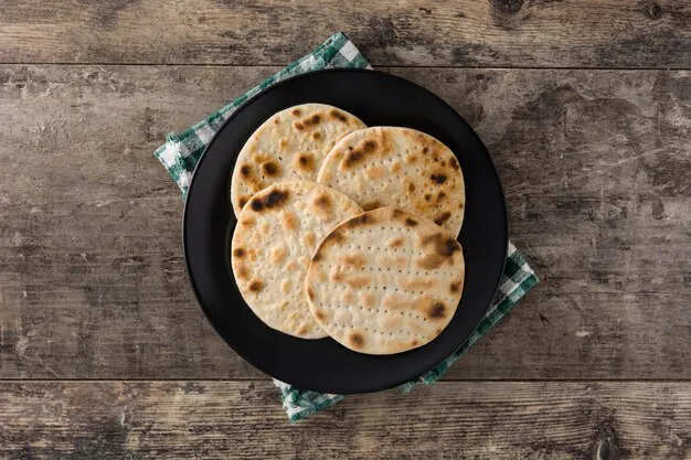 pita bread on a black circular plate
