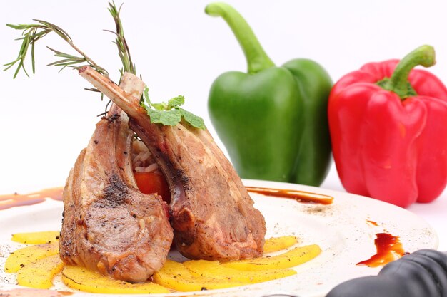 cooked lamb in a white plate