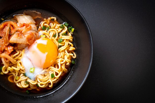 top half view of ramen in a black bowl